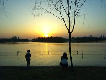 Scenic view of lake at sunset