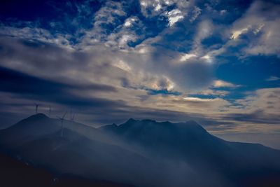 Low angle view of silhouette mountain against sky