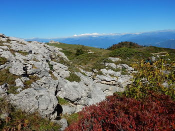 Scenic view of mountain against blue sky