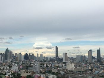 Modern buildings in city against sky