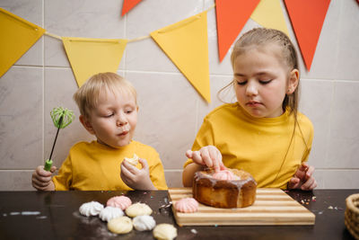 Children eat festive easter sweets. high quality photo
