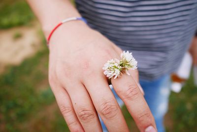 Close-up of hand holding flower