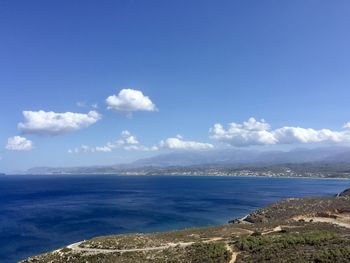 Scenic view of sea against blue sky