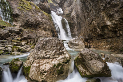 View of waterfall along rocks