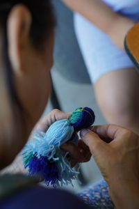 Close-up of woman holding flower