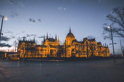 View of illuminated buildings at waterfront