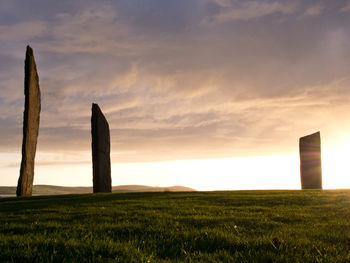 Scenic view of field against sky during sunset