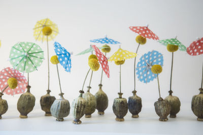 Close-up of decorations over white background