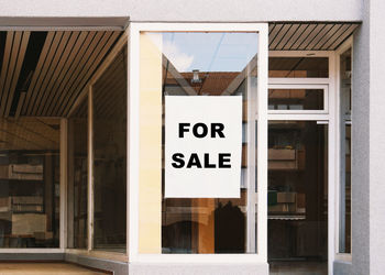 Text on glass window of building