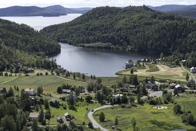 High angle view of landscape and lake against mountains