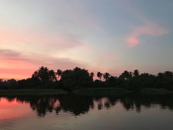 Scenic view of lake against sky during sunset