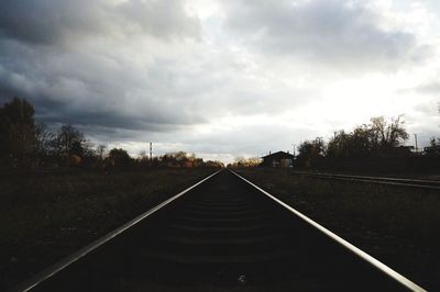 Surface level of railroad tracks against sky