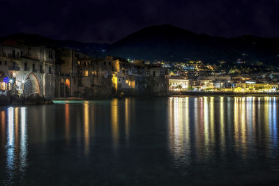 Illuminated buildings in city at night