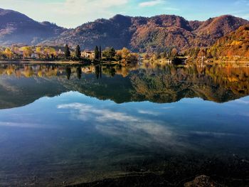 Scenic view of lake and mountains against sky