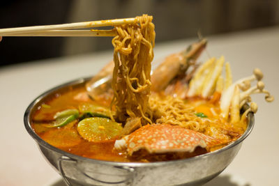 Close-up of noodles in bowl on table