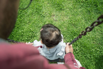 Rear view of woman on grass