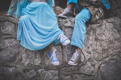 Low section of people standing on rock