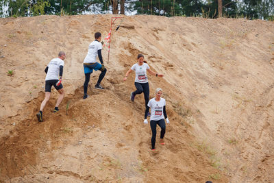 Rear view of people running