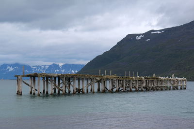 Scenic view of mountains against cloudy sky