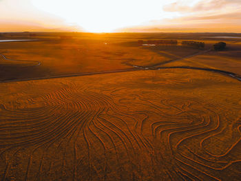 Scenic view of landscape against sky during sunset