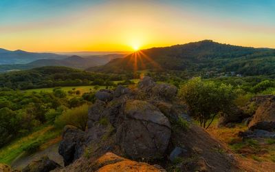 Scenic view of mountains against sky during sunset