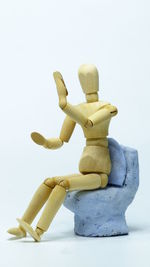 Close-up of statue against black background