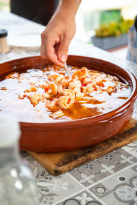 Cropped hand preparing food