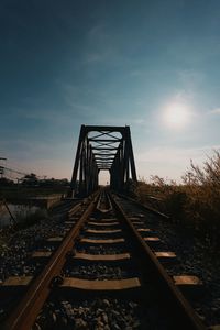 Surface level of railroad tracks against sky