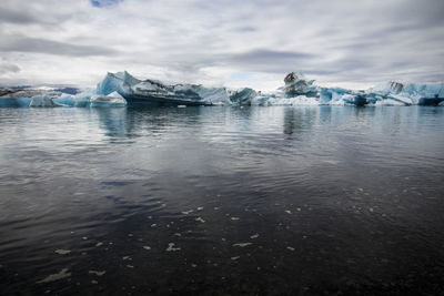 Scenic view of frozen sea against sky