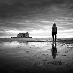 Scenic view of sea against cloudy sky