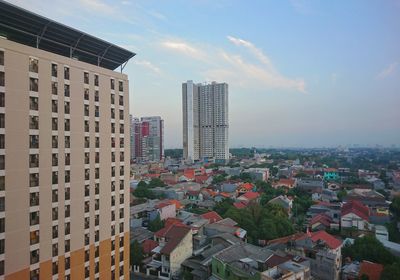 Modern buildings in city against sky