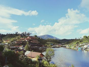 Panoramic view of townscape by buildings against sky