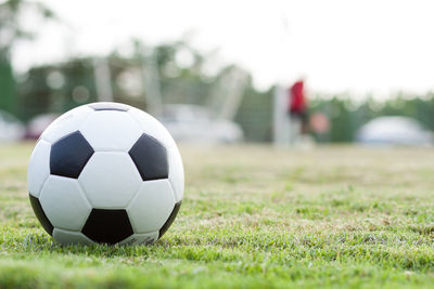 Close-up of soccer ball on grass