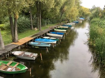 Boats moored in lake