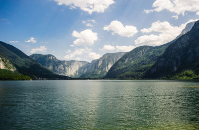 Scenic view of lake and mountains against sky