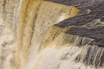 Close-up of water flowing through rocks