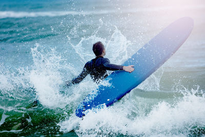 Man surfing in sea