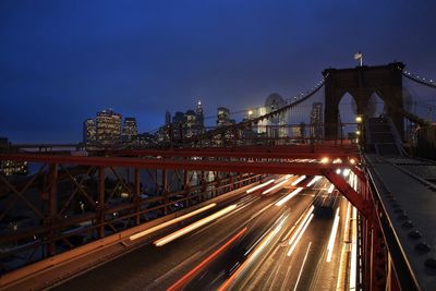 Light trails on suspension bridge at night