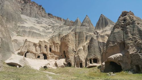 Low angle view of rock formation against clear sky