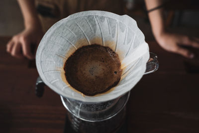 Barista dripping coffee and slow coffee wooden bar style