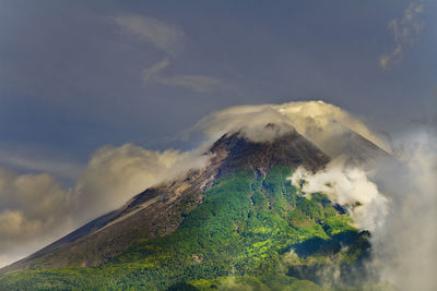 Scenic view of volcanic mountain against sky