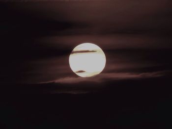 Close-up of moon against sky at sunset