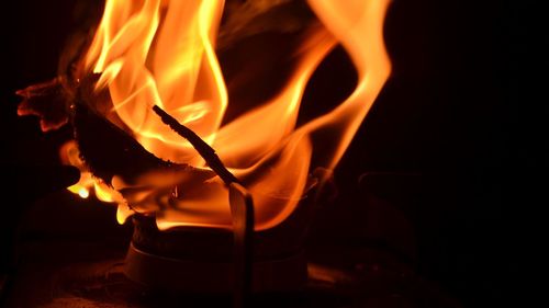 Close-up of fire against black background.