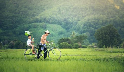 Cycling in the middle of the rice fields with children