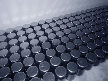High angle view of jars arranged by wall