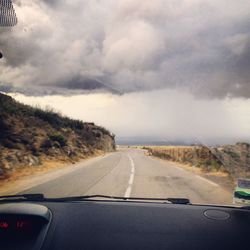 Road seen through car windshield