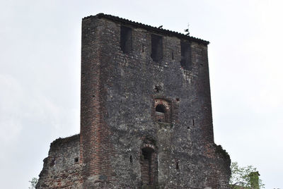 Low angle view of old building against sky