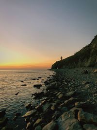 Scenic view of sea against clear sky during sunset