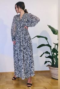 Woman looking at while standing on floor at home