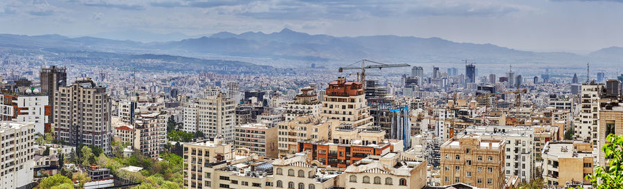 High angle view of buildings in city against sky